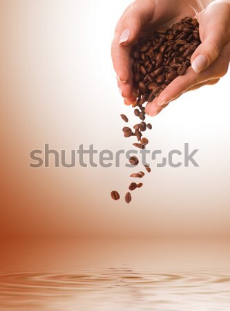 Handfuls of coffee beans Stock photo © Nejron