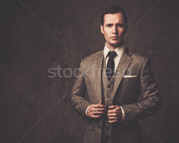 Stock photo: Well-dressed man in grey suit