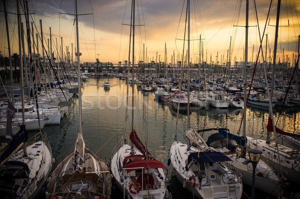 Stock photo: Yachts and boats in harbour on sunset