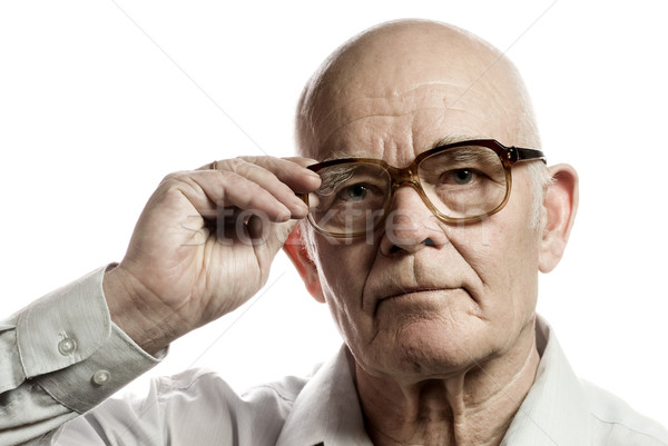 Stock photo: Elderly man with massive glasses isolated on white background