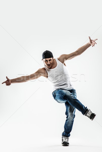 Man dancer showing break-dancing moves isolated on white  Stock photo © Nejron