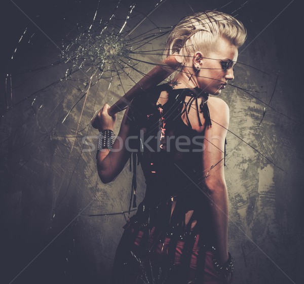 Punk girl behind broken glass with a baseball bat Stock photo © Nejron