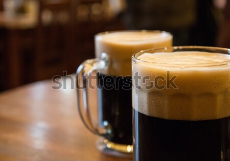 Twee bril donkere bier tabel partij Stockfoto © Nejron