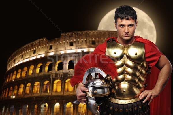 Roman legionary soldier in front of coliseum at night time Stock photo © Nejron