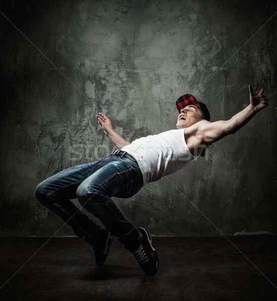 Man dancer showing break-dancing moves Stock photo © Nejron