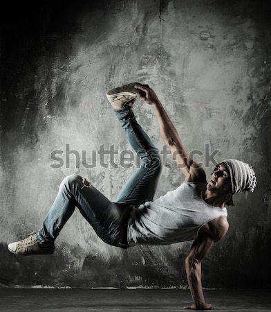 Young b-boy man with naked torso doing brake dancing movements  Stock photo © Nejron