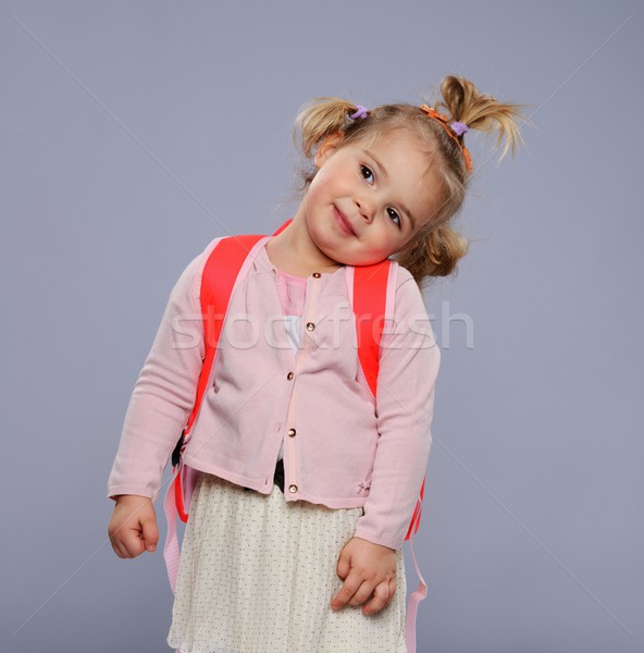 Grappig weinig schoolmeisje rugzak geïsoleerd grijs Stockfoto © Nejron