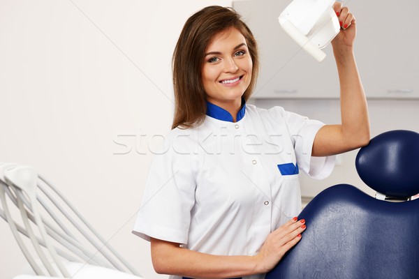 Young beautiful brunette woman dentist at dentist's surgery  Stock photo © Nejron