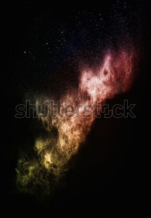 Colourful powder exploding isolated on black Stock photo © Nejron