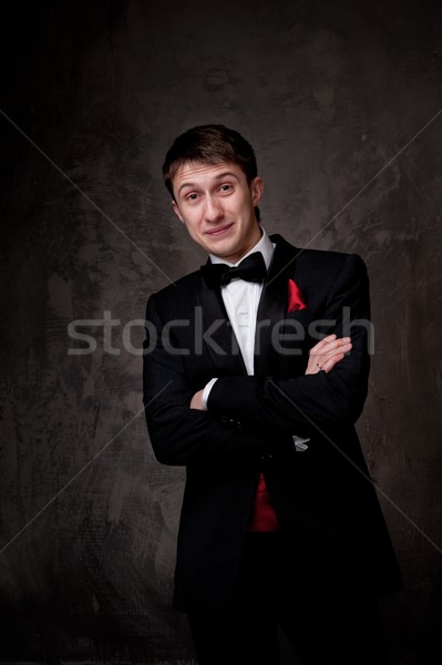 Funny young man wearing tuxedo. Stock photo © Nejron