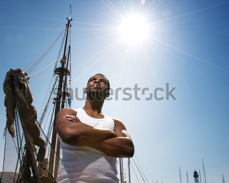 Jóképű férfi hajók csónak halászat póló Stock fotó © Nejron
