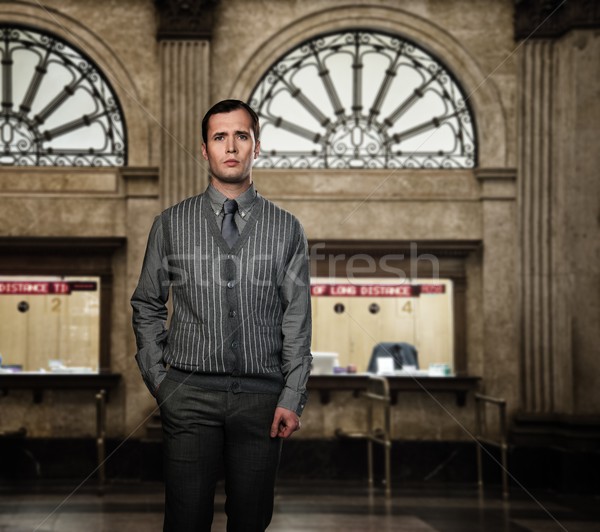 Confident man wearing grey vest and necktie against ticket office on train station Stock photo © Nejron