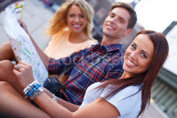 Stock photo: Three friends tourist with map outdoors 