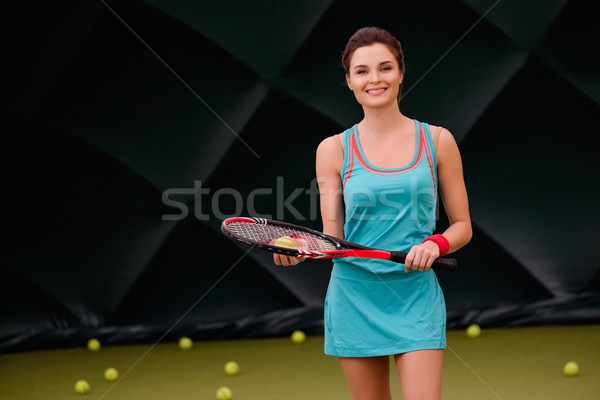 Cheerful woman with racquet and tennis ball Stock photo © Nejron