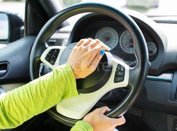 Woman hand pressing on a car horn  Stock photo © Nejron