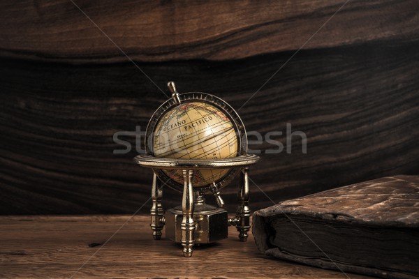 Vintage book and little globe on a wooden background  Stock photo © Nejron