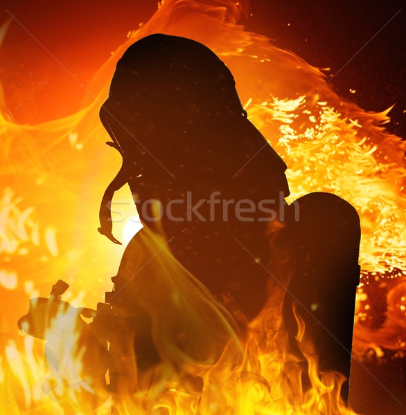 Firefighters silhouette in a burning flame  Stock photo © Nejron