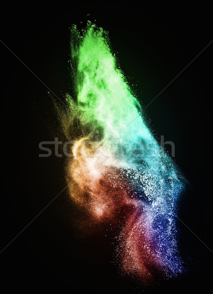 Colourful powder exploding isolated on black Stock photo © Nejron