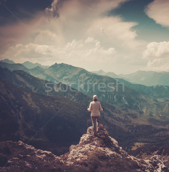 Kobieta turysta górę górskich człowiek spaceru Zdjęcia stock © Nejron