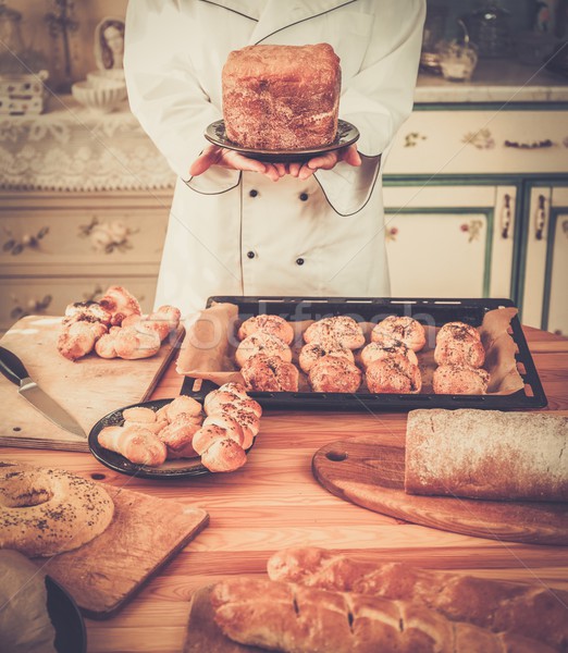 Cook hands holding homemade baked goods Stock photo © Nejron