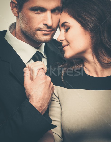 Happy smiling couple in suit and dress  Stock photo © Nejron