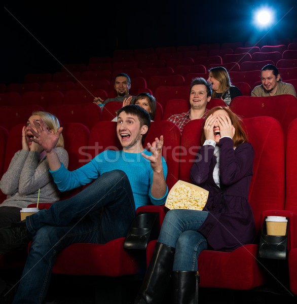 Group of young people watching movie in cinema Stock photo © Nejron
