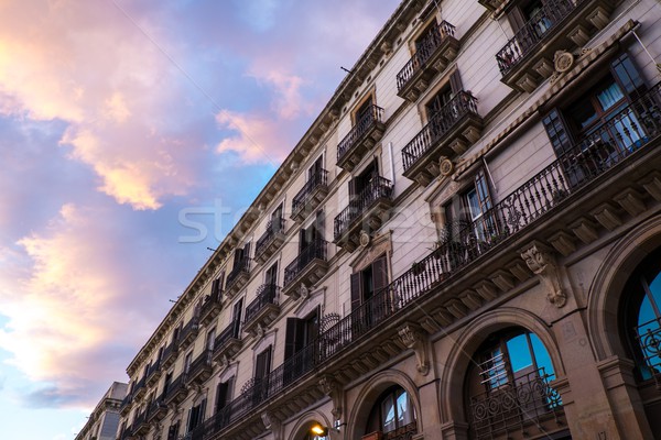 Building facade with  balconies against beautiful sky Stock photo © Nejron