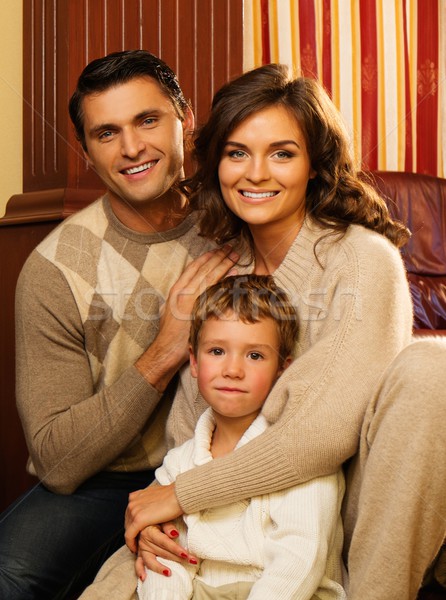 Family in warm cashmere clothes in home interior  Stock photo © Nejron