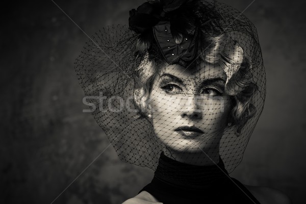 Monochrome picture of 
elegant blond retro woman   wearing little hat with veil  Stock photo © Nejron