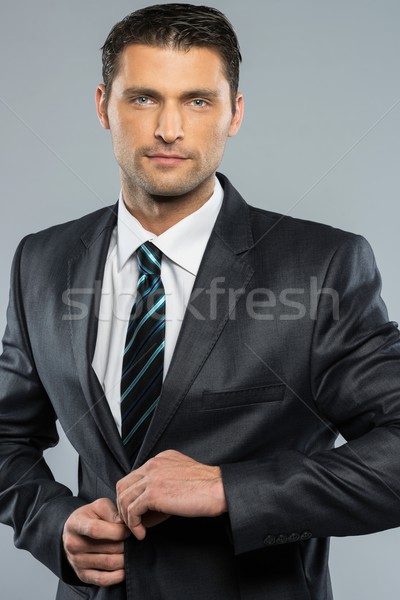 Knappe man zwart pak stropdas business glimlach model Stockfoto © Nejron