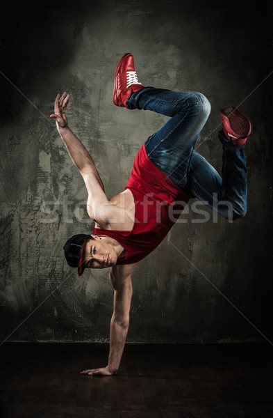 Man dancer showing break-dancing moves Stock photo © Nejron