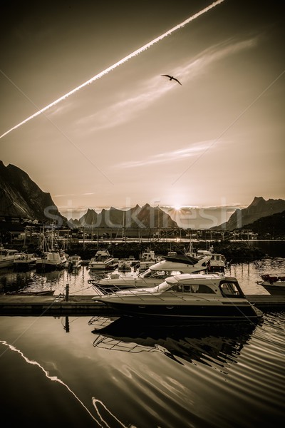 Yachts and boats near moorage at sunset in Reine village, Norway Stock photo © Nejron