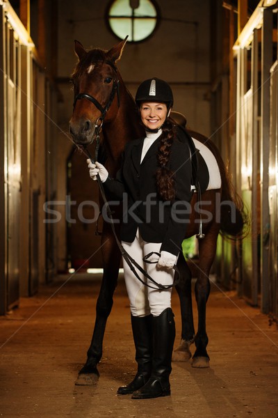 Beautiful girl with her horse in a stall  Stock photo © Nejron