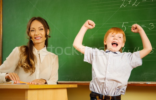 Little happy redhead boy answering near blackboard in school  Stock photo © Nejron