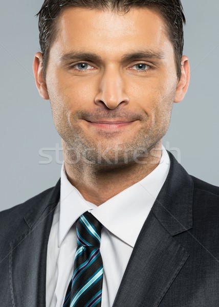 Jóképű férfi fekete öltöny nyakkendő üzlet mosoly modell Stock fotó © Nejron