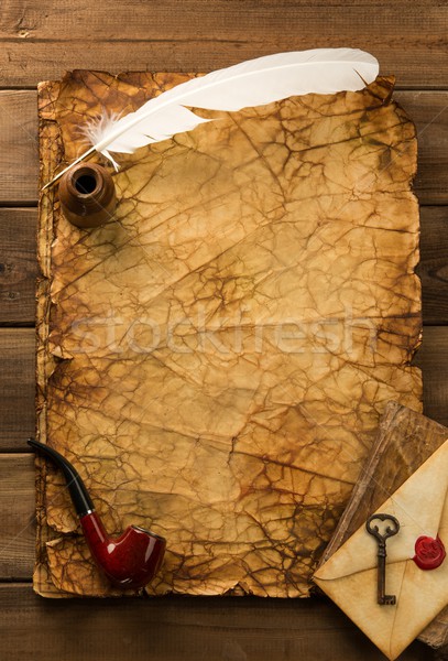 Stock photo: Smoking pipe, book and writing accessories on old blank paper