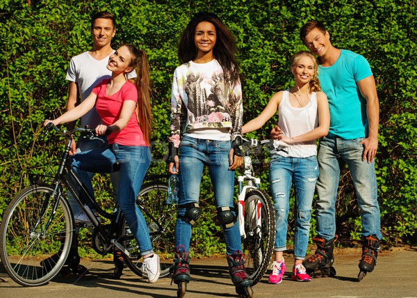 Multi ethnic group of sporty teenage friends in a park  Stock photo © Nejron