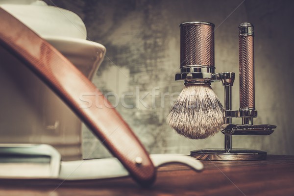 Shaving razors and bowl with foam on wooden background  Stock photo © Nejron