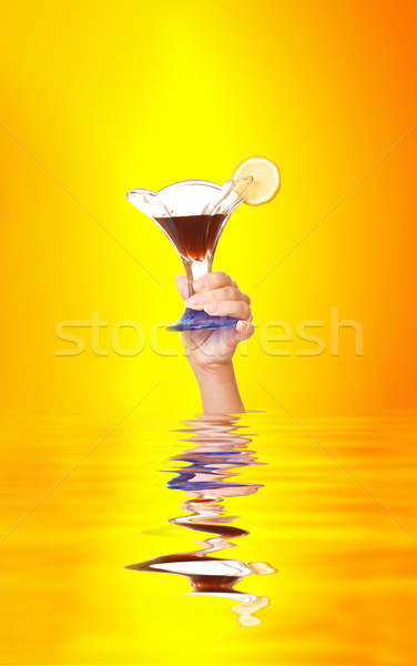 Hand with a cocktail glass out of rendered water Stock photo © Nejron