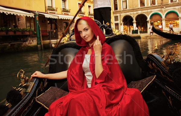 Beautiful woman in red cloak riding on gondola Stock photo © Nejron