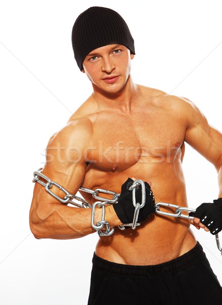 Handsome muscular man in beanie hat with chain Stock photo © Nejron