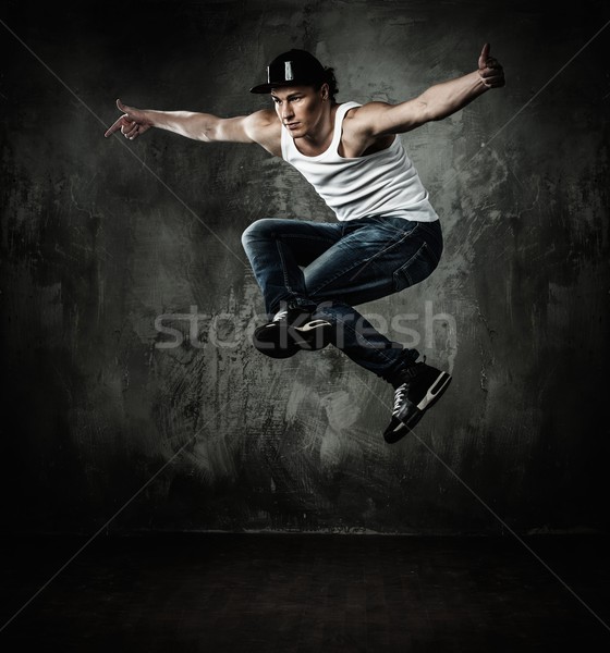 Man dancer showing break-dancing moves Stock photo © Nejron