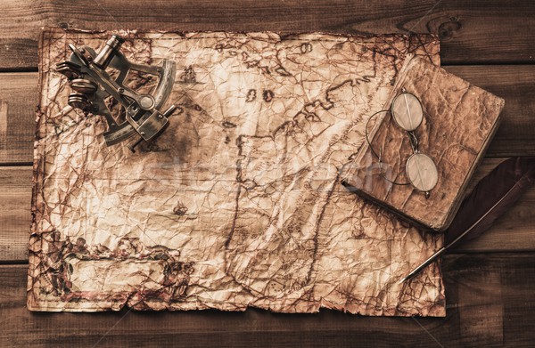 Sextant and logbook on a vintage map  Stock photo © Nejron