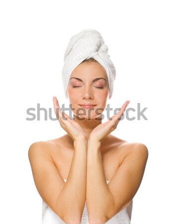 Young lovely lady applying moisturizer to her face after shower Stock photo © Nejron