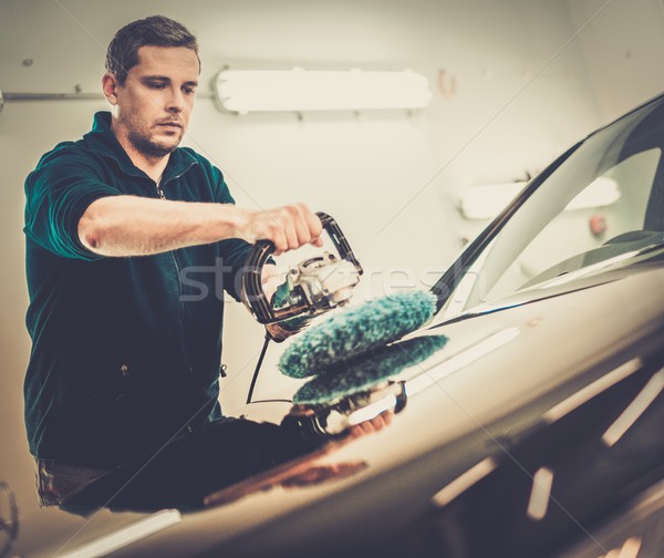 Man on a car wash polishing car with a polish machine  Stock photo © Nejron