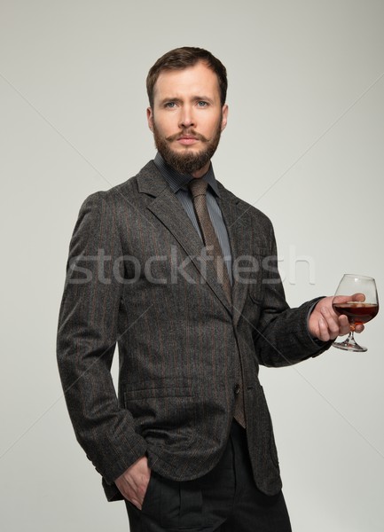 Jóképű férfi kabát üveg ital divat Stock fotó © Nejron