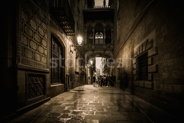 People walking at Carrer del Bisbe  in Barri Gotic, Barcelona Stock photo © Nejron