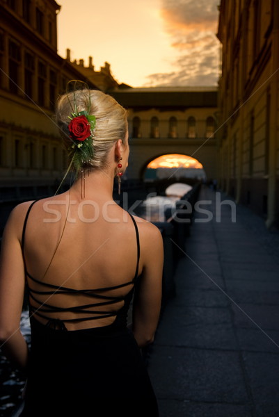 Beautiful gril near the river at sunset time Stock photo © Nejron