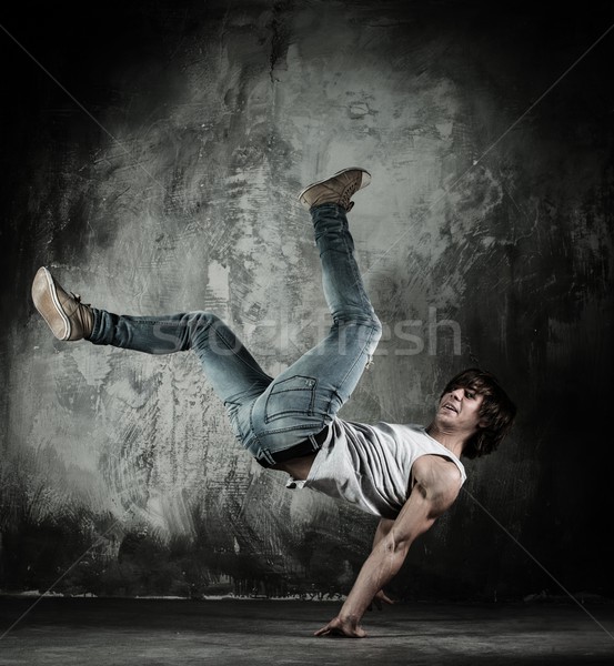 Young b-boy man doing brake dancing movements  Stock photo © Nejron