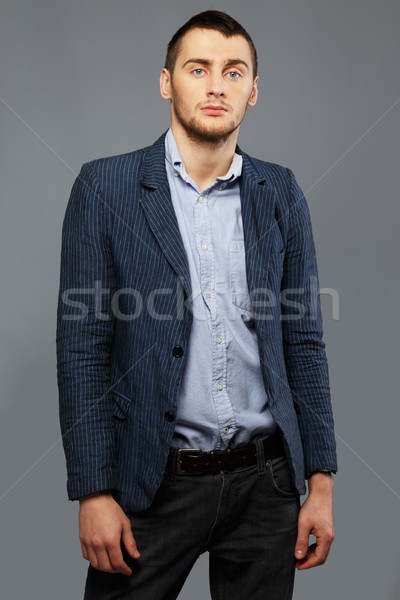 Handsome young man in a blue shirt and jacket Stock photo © Nejron